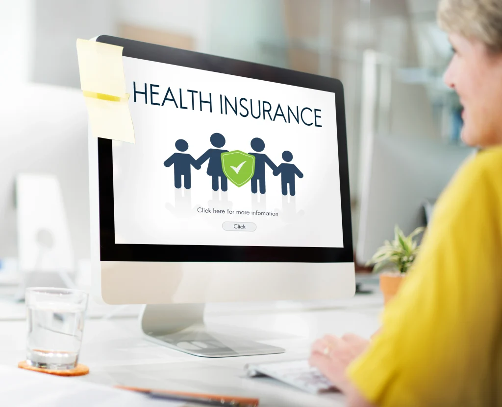 health insurance webpage with family icon on desktop computer screen
