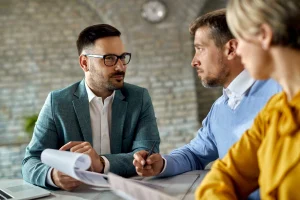 insurance broker having meeting with couple for short term health insurance options